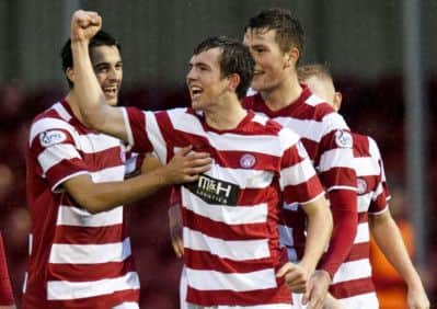 Louis Longridge celebrates extending Hamilton's lead. Picture: SNS