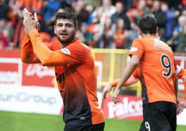Nadir Ciftci celebrates his second goal. Picture: SNS
