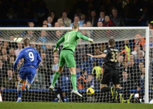 A mix-up between oe Hart and Matija Nastasic presents Fernando Torres with an open goal as the Chelsea striker claims a dramatic late win. Picture: Reuters