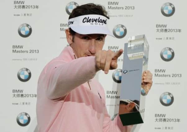 Gonzalo Fernandez-Castano shows off the trophy after winning the BMW Masters. Picture: Getty