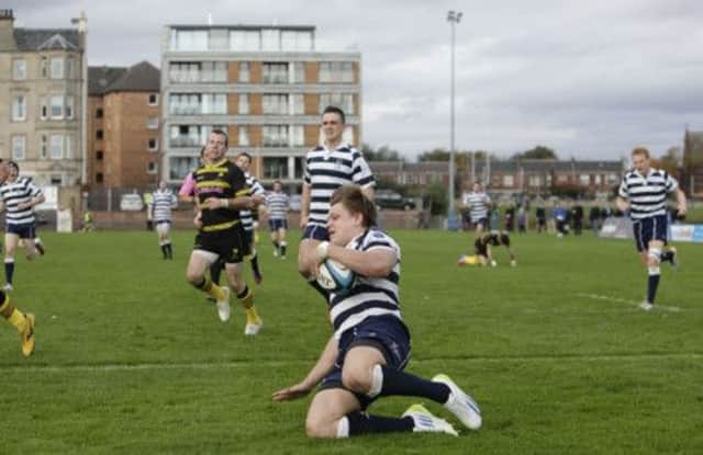 Hooker George Turner crosses for Heriot's' second try against league leaders Melrose at Goldenacre on Saturday. Picture: Toby Williams