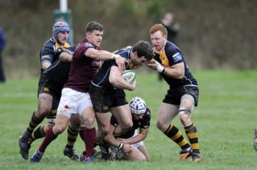 Currie's Adam Alexander resists the attempt of Gala's Grayson Hart to pull him back during the Borders club's victory. Picture: Greg Macvean
