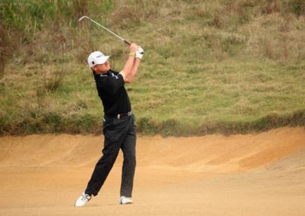 Paul Lawrie in action in Shanghai. The golfer was in China as his golf centre was raided. Picture: Getty