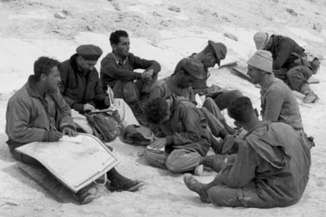 Israeli army officer Ariel Sharon, left, with his troops before
the invasion of the Sinai Peninsular on this day in 1956. Picture: Getty