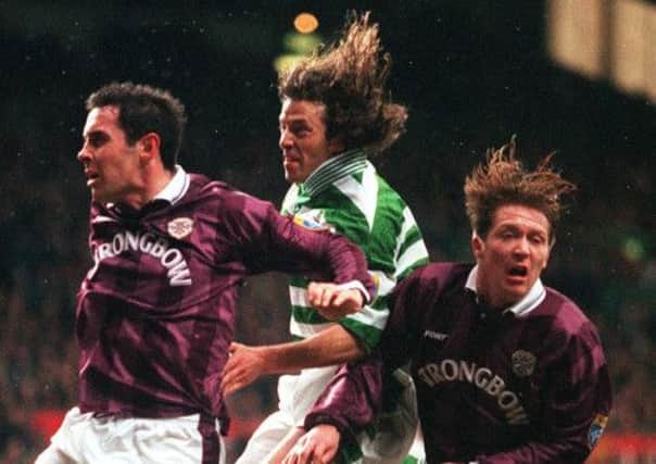 Celtic striker Jorge Cadete leaps above Gary Locke of Hearts to score his 28th goal of the 1996-97 season. Picture: Ian Rutherford