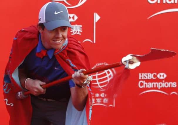 Rory McIlroy gets dressed up for a photocall ahead of the WGC-HSBC Champions event in Shanghai yesterday. Picture: Reuters