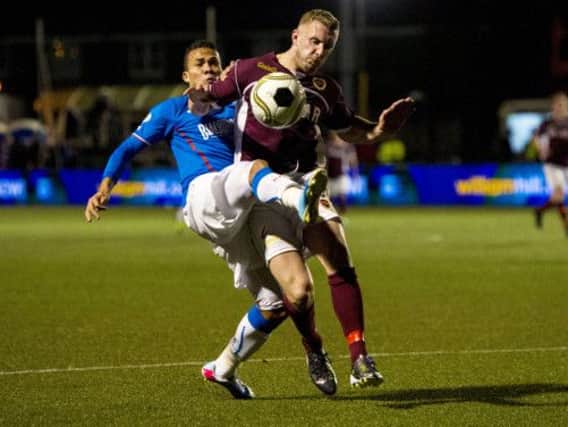 Rangers' Arnold Peralta (left) challenges Kevin McKinlay. Picture: SNS