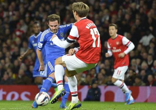 Chelseas Juan Mata fires in the shot which put his side two up against Arsenal. Picture: Toby Melville/Reuters