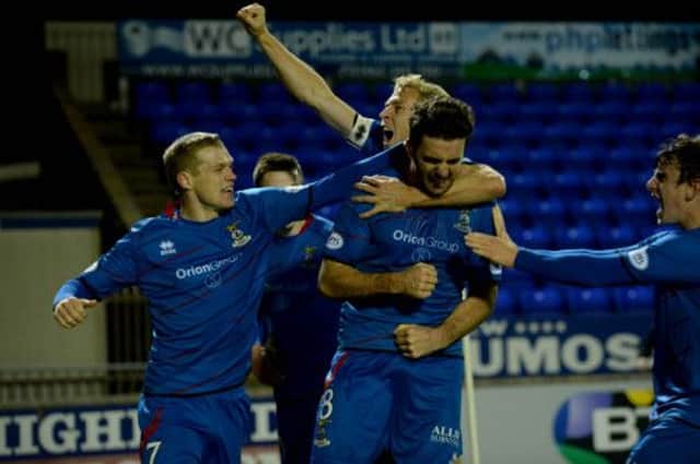 Thistle's hero Ross Draper celebrates his late goal with captain Richie Foran (centre) and Billy McKay (left). Picture: SNS