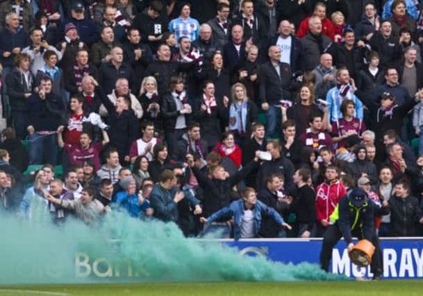 Hibs and Hearts fans face stern punishment if caught with flares. Picture: Ian Georgeson