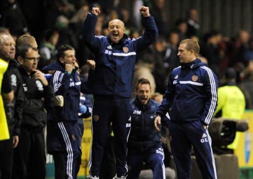 Hearts assistant Billy Brown celebrates his team's victory over Pat Fenlon's Hibs. Picture: Ian Rutherford