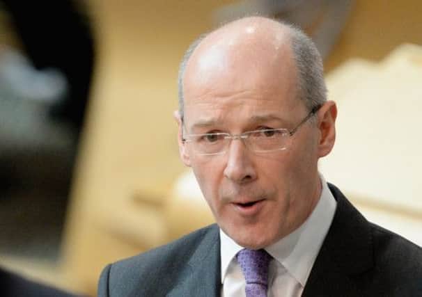John Swinney said councils have received more money than needed to fund the council tax freeze. Picture: Getty