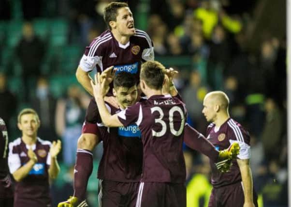 Hearts celebrate dumping rivals Hibs out of the league cup. Picture: SNS