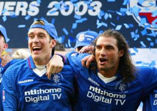 Fernando Ricksen and Lorenzo Amoruso enjoy League Cup victory over Celtic in 2000. Picture: Reuters