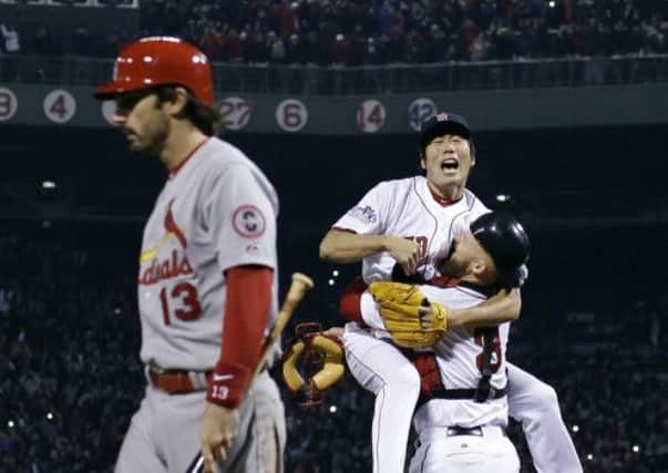 Koji Uehara and David Ross of Boston Red Sox celebrate victory  in baseball's World Series. Picture: AP