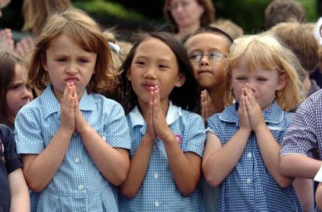 Changes to religious observance in schools, meaning parents would have to opt in, have been rejected by the Scottish Government. Picture: PA