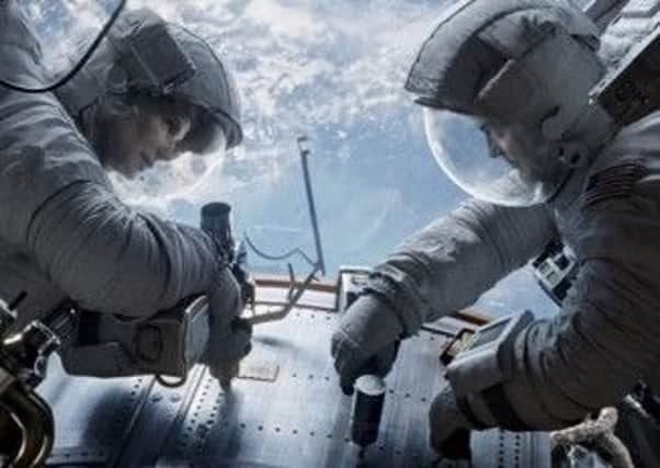 Sandra Bullock and George Clooney in Gravity. Picture: Comp