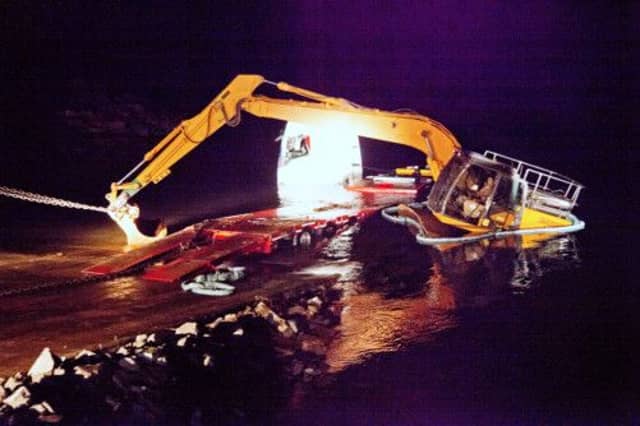 A lorry and a 23-ton digger being recovered. Picture: Hemedia