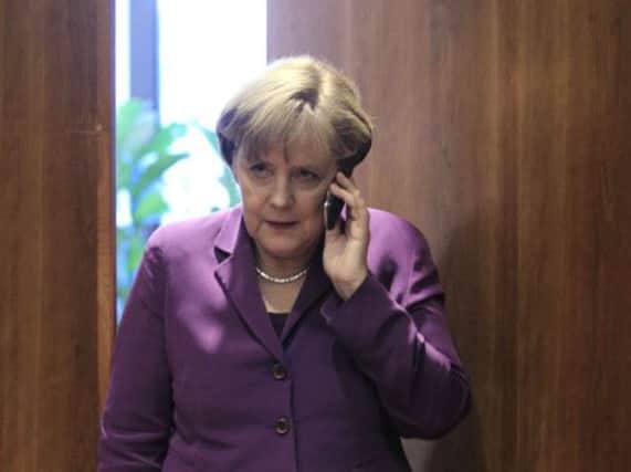 Angela Merkel must deal with the indignity of having her phone calls recorded by US security forces. Picture: Reuters
