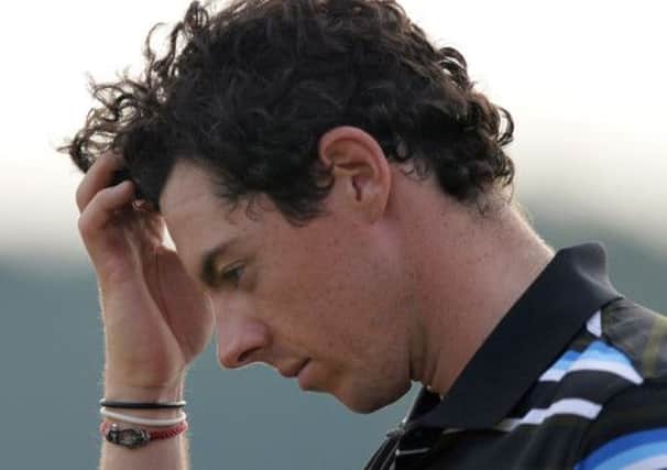 Rory McIlroy feels the strain after he let his lead slip in Shanghai after a poor end to his second round. Picture: AFP/Getty Images