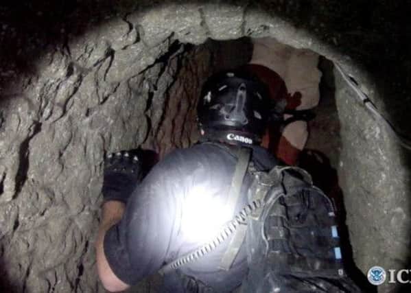 A US Homeland Security agent inside the tunnel. Picture: Getty