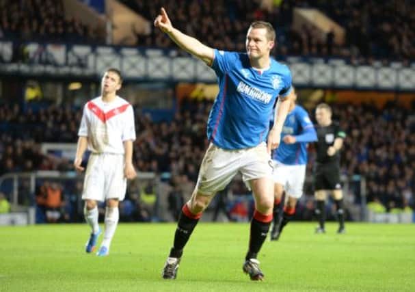 Jon Daly celebrates after giving Rangers a 1-0 lead. Picture: SNS