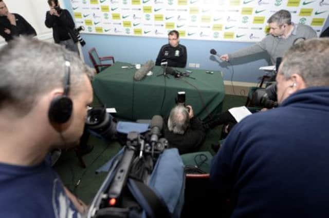 Pat Fenlon cuts a lonely figure as he explains the reasons for his resignation as Hibs manager at a press conference. Picture: SNS