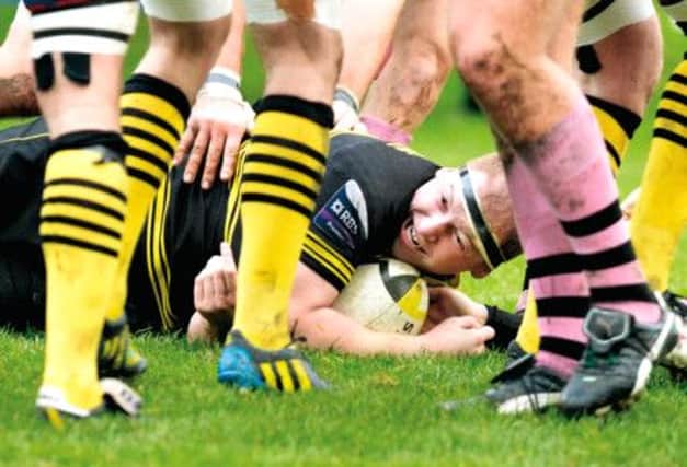 Melrose No.8 Andrew Nagle touches down to score a try for the home side against Ayr.  Picture: SNS