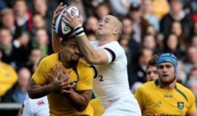 Mike Brown of England claims a high ball ahead of Will Genia of Australia during the QBE International match between England and Australia. Picture: Getty