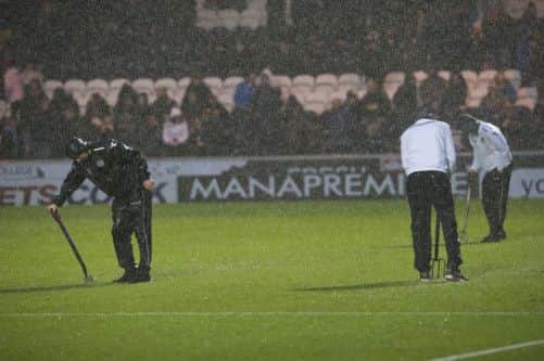 St Mirren youth players try to help clear the pitch. Picture: SNS