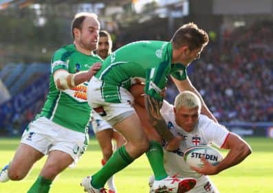 Ryan Hall scores his third try despite the efforts of James Mendeika, centre, and Liam Finn. Picture: Getty