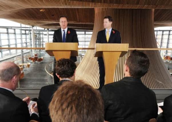 David Cameron and Nick Clegg at the Senedd in Cardiff Bay to meet First Minister Carwyn Jones. Picture: PA