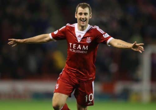 Aberdeen's Niall McGinn celebrates scoring the opening goal. Picture: PA
