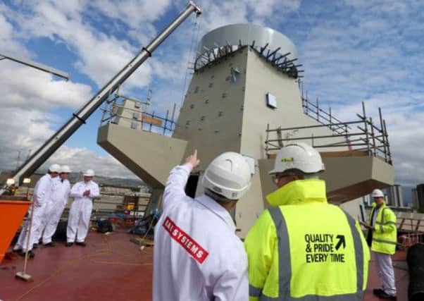 Staff at Scotstoun survey the radar tower on the final section for the Queen Elizabeth aircraft carrier. Picture: PA