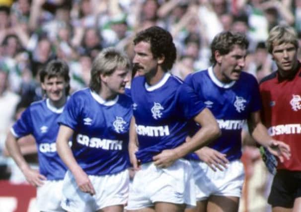 Terry Butcher, second from the right, and his Rangers team-mates regroup during a torrid match at Easter Road in 1986. Picture: SNS