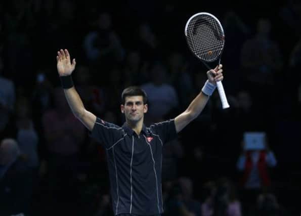 Novak Djokovic celebrates his opening World Tour Finals win over Roger Federer. Picture: Reuters