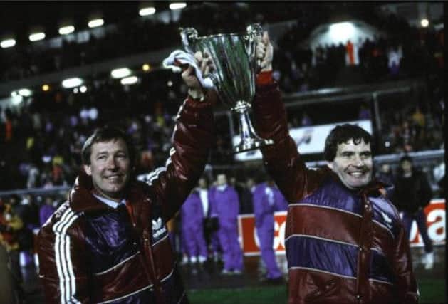 Sir Alex Ferguson, left, with the European Cup Winners Cup after Aberdeen's triumph in 1983. Picture: SNS