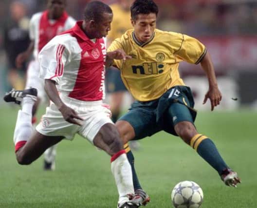 Bobby Petta, in action for Celtic, tussles with Ajax player Hatem Trabelsi during the teams' 2001 clash in Amsterdam. Picture: AP