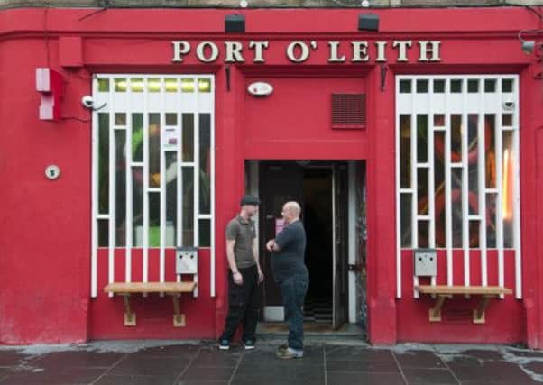 Smokers pop outside the Port O' Leith for a cigarette. Picture: Alex Hewitt