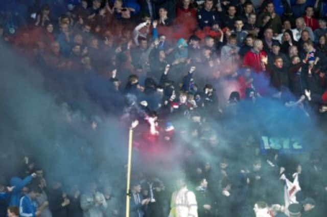 There was crowd trouble as supporters set off smoke bombs and flares before the match. Picture: SNS