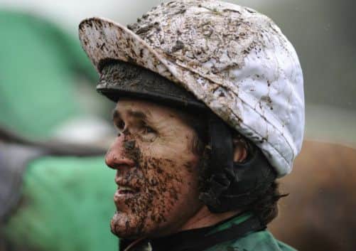 A muddy Tony McCoy at Chepstow, where he rode Minella For Steak to victory yesterday. Picture: Getty