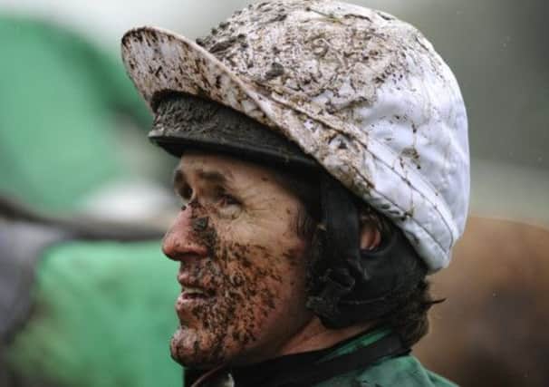 A muddy Tony McCoy at Chepstow, where he rode Minella For Steak to victory yesterday. Picture: Getty