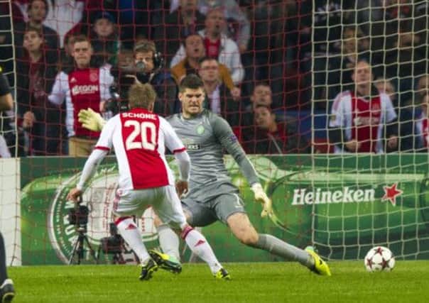 Lasse Schone slots past Fraser Forster to put Ajax ahead. Picture: SNS