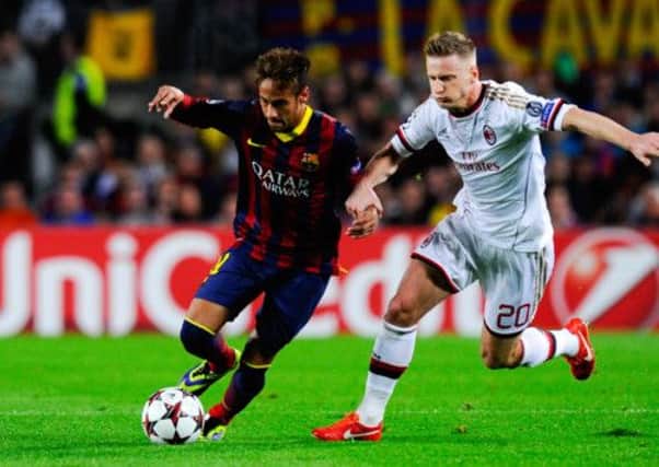 Neymar duels for the ball with Ignazio Abate of AC Milan. Picture: Getty