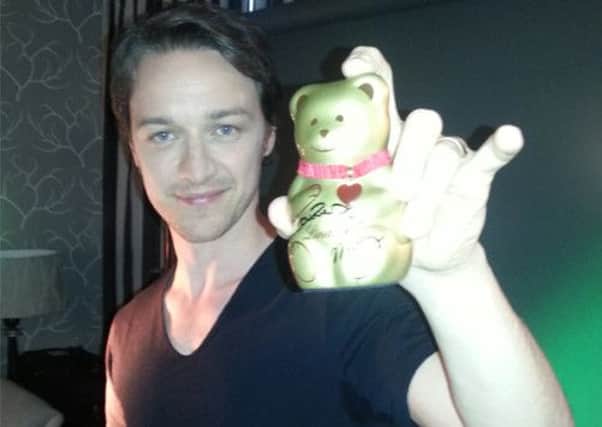 James McAvoy shows off his signed Lindt bear. Picture: Contributed