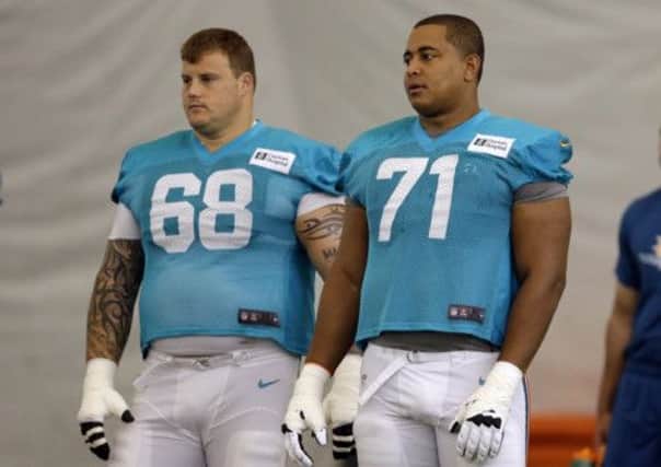 Rookie Jonathan Martin, right, has accused teammate Richie Incognito, left, of racist bullying and threats to kill him. Picture: AP
