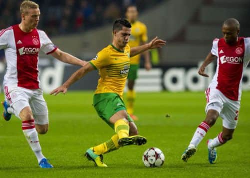 Celtic midfielder Beram Kayal is closed down by Kolbeinn Sigthorsson (left) and Thulani Serero (right) during last night's defeat. Picture: SNS