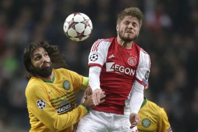 Georgios Samaras and Lasse Schone challenge for the ball in the Champions League match on Wednesday. Picture: Peter Dejong/AP