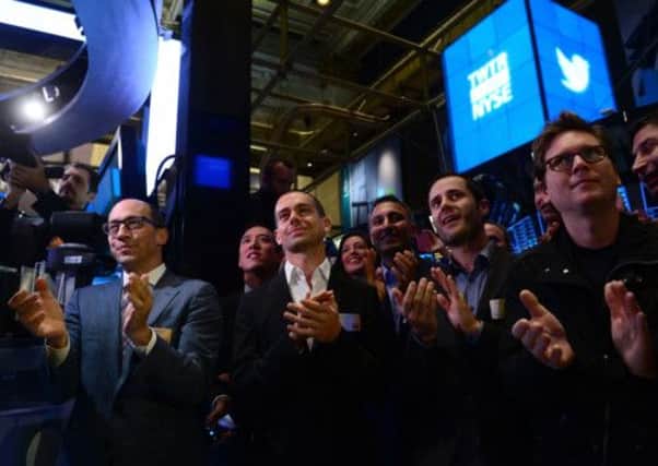 Twitter CEO Richard' Costolo, and co-founders, Jack Dorsey,  Evan Williams and Christopher Isaac 'Biz' Stone, applaud at the opening bell of the NYSE. Picture: Getty