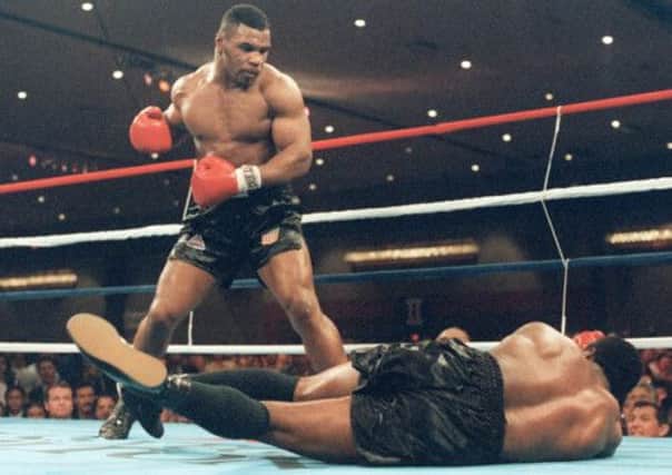 Mike Tyson, seen at the peak of his powers against Trevor Berbick in 1986, has given a fascinting new insight into his chaotic life. Picture: AFP/Getty